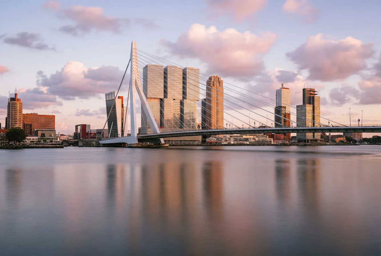 Rotterdam skyline at blue hour with the Erasmus Bridge across the Nieuwe Maas